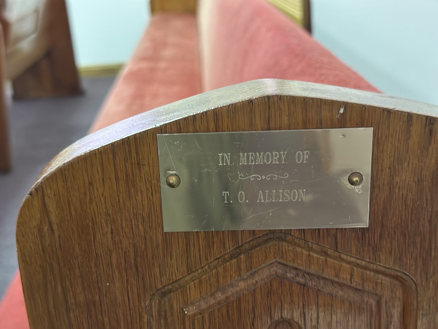 Memorial plaque reading In memory of T. O. Allison